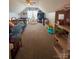 Spacious bonus room features toys, a ceiling fan, beds and a play tent at 15003 Jerpoint Abby Dr, Charlotte, NC 28273