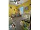 Bright Bedroom with a crib, rocking chair, soft carpet, and a window with natural light at 15003 Jerpoint Abby Dr, Charlotte, NC 28273