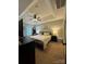 Spacious bedroom features neutral paint, ceiling fan, large bed with lamps, and black dressers at 15003 Jerpoint Abby Dr, Charlotte, NC 28273