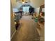 Expansive bonus room with carpet, featuring a tent, play sets, and a TV setup at 15003 Jerpoint Abby Dr, Charlotte, NC 28273