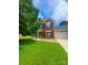 Charming two-story home with a well-manicured lawn and a combination brick and siding exterior at 15003 Jerpoint Abby Dr, Charlotte, NC 28273