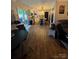 Open-concept layout with combined living room, dining room, and modern kitchen at 15003 Jerpoint Abby Dr, Charlotte, NC 28273