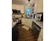 Charming kitchen featuring white cabinets, granite countertops, and stainless steel appliances at 15003 Jerpoint Abby Dr, Charlotte, NC 28273