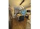 Well-lit kitchen featuring an island, granite counters, stainless appliances, and hardwood flooring at 15003 Jerpoint Abby Dr, Charlotte, NC 28273