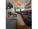 Open-concept living room with a fireplace, comfortable seating, and views of the dining area at 15003 Jerpoint Abby Dr, Charlotte, NC 28273