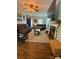 Inviting living room featuring a ceiling fan, comfortable seating, and a decorative fireplace, all illuminated by natural light at 15003 Jerpoint Abby Dr, Charlotte, NC 28273