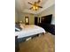 Spacious bedroom featuring a comfortable bed, tray ceiling, and a large television for relaxing evenings at 15003 Jerpoint Abby Dr, Charlotte, NC 28273