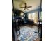 Spacious home office showcasing a ceiling fan, natural light, and work space for productivity at 15003 Jerpoint Abby Dr, Charlotte, NC 28273