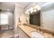 Bathroom with double vanity, granite countertops and decorative lighting at 1524 Court Cir, Newton, NC 28658