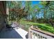 Relaxing deck with table and chairs overlooking fenced backyard; perfect for enjoying outdoor meals and scenic views at 1524 Court Cir, Newton, NC 28658