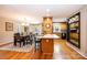Open-concept dining area with hardwood floors, bar seating, and natural light; perfect for everyday living at 1524 Court Cir, Newton, NC 28658
