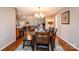 Elegant dining room area with hardwood floors, a large table, and seamless flow to the living space at 1524 Court Cir, Newton, NC 28658