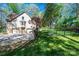 View of a home's exterior with a two-car garage and fenced in yard at 1524 Court Cir, Newton, NC 28658