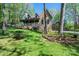 Inviting stone-clad home with a charming porch and beautifully landscaped front yard at 1524 Court Cir, Newton, NC 28658