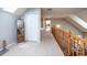 Carpeted hallway featuring a double door closet and view to the office at 1524 Court Cir, Newton, NC 28658
