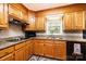 Cozy kitchen featuring wood cabinets, granite countertops and stainless steel appliances at 1524 Court Cir, Newton, NC 28658