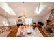 This living room features a stone fireplace, lots of natural light, and overlooks the foyer at 1524 Court Cir, Newton, NC 28658