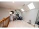 This loft features skylights, carpet flooring, and overlooks the first floor of the home at 1524 Court Cir, Newton, NC 28658