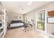 Bright office with built-in bookshelves and a large window overlooking the backyard at 1524 Court Cir, Newton, NC 28658