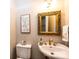 Elegant powder room featuring a decorative mirror, vanity, and modern fixtures at 1524 Court Cir, Newton, NC 28658