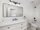 Bright bathroom with white cabinetry, stylish mirror, and modern fixtures for a clean aesthetic at 15906 Youngblood Rd, Charlotte, NC 28278