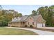Beautifully landscaped brick home featuring a covered porch and an attached two-car garage at 15906 Youngblood Rd, Charlotte, NC 28278