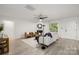 Spacious living room with neutral tones, a modern fireplace, and plenty of natural light at 15906 Youngblood Rd, Charlotte, NC 28278