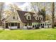 Spacious backyard featuring a patio with outdoor seating and grilling area and lush green grass at 16 Catawba Ridge Ct, Clover, SC 29710