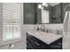 Stylish bathroom with a marble countertop, sleek fixtures, and a modern mirror at 16 Catawba Ridge Ct, Clover, SC 29710