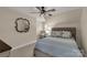 Stylish bedroom with plush headboard and decorative pillows; features include a ceiling fan and plush carpeting at 16 Catawba Ridge Ct, Clover, SC 29710