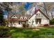 Charming two-story home with a manicured lawn and a welcoming American flag at 16 Catawba Ridge Ct, Clover, SC 29710