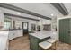 Modern kitchen with a large island, white cabinets, and stainless steel appliances at 16 Catawba Ridge Ct, Clover, SC 29710