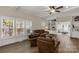 Spacious living room features hardwood floors, large windows, and classic decor, with a view to another room at 16 Catawba Ridge Ct, Clover, SC 29710