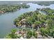 Stunning aerial view of waterfront homes surrounded by lush greenery and serene lake waters at 16149 Haroa Ct, Tega Cay, SC 29708
