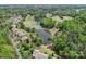 Scenic aerial view of residential homes alongside a lush golf course and a tranquil pond at 16149 Haroa Ct, Tega Cay, SC 29708
