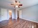 Spacious bedroom with hardwood floors and a ceiling fan at 16149 Haroa Ct, Tega Cay, SC 29708