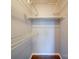 An empty closet with metal racks and hardwood floors at 16149 Haroa Ct, Tega Cay, SC 29708