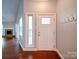Welcoming foyer features hardwood floors, a decorative front door, and coat hooks at 16149 Haroa Ct, Tega Cay, SC 29708