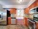 Updated kitchen featuring stainless steel appliances, stone countertops, and wooden cabinetry at 16149 Haroa Ct, Tega Cay, SC 29708