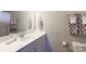 Bathroom featuring a vanity with sink, a large mirror, and a toilet with a shower curtain in the background at 19034 Cypress Garden Dr, Davidson, NC 28036