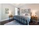 Bedroom with a wrought iron bed and a doorway leading to the bathroom at 19034 Cypress Garden Dr, Davidson, NC 28036
