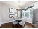 Cozy breakfast nook with a round table and stylish chandelier, perfect for casual dining at 19034 Cypress Garden Dr, Davidson, NC 28036