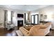 Comfortable living room featuring a fireplace, french doors, and stylish decor at 19034 Cypress Garden Dr, Davidson, NC 28036