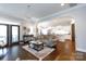 Elegant living room with hardwood floors, chandelier, and open access to the kitchen at 19034 Cypress Garden Dr, Davidson, NC 28036