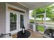 Inviting screened porch with outdoor seating and a glimpse of the surrounding neighborhood at 19034 Cypress Garden Dr, Davidson, NC 28036