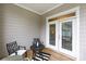 Cozy porch with outdoor seating featuring a view of the neighborhood through the screened enclosure at 19034 Cypress Garden Dr, Davidson, NC 28036