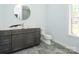 Bathroom featuring a gray vanity with quartz countertop and light gray tile flooring at 2008 Plain Field Dr, Bessemer City, NC 28016