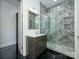 Bathroom with a glass shower and marble tile, featuring a sink with a vanity at 2008 Plain Field Dr, Bessemer City, NC 28016