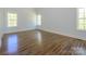 Bright bedroom with hardwood floors and natural light from two windows at 2008 Plain Field Dr, Bessemer City, NC 28016
