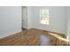 Bedroom with hardwood floors and natural light from one window at 2008 Plain Field Dr, Bessemer City, NC 28016